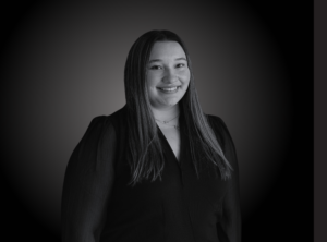 Headshot of Caitlyn De Roux